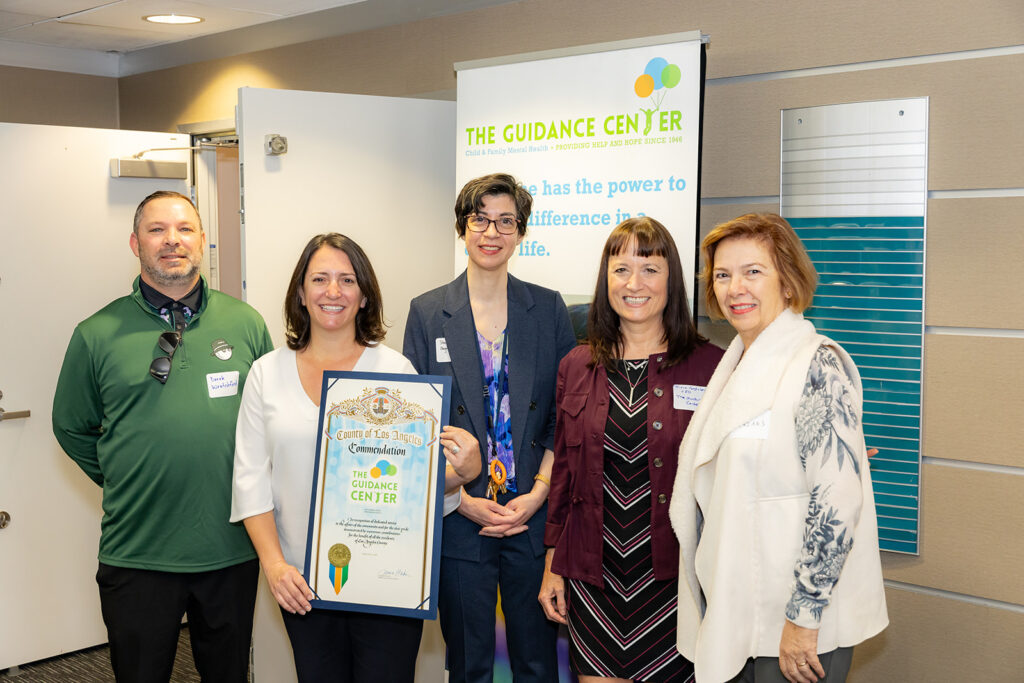 Community leaders and supporters gather to celebrate The Guidance Center’s impact, proudly displaying a commendation from the County of Los Angeles, presented by Supervisor Janice Hahn’s representative, Kelly Cross